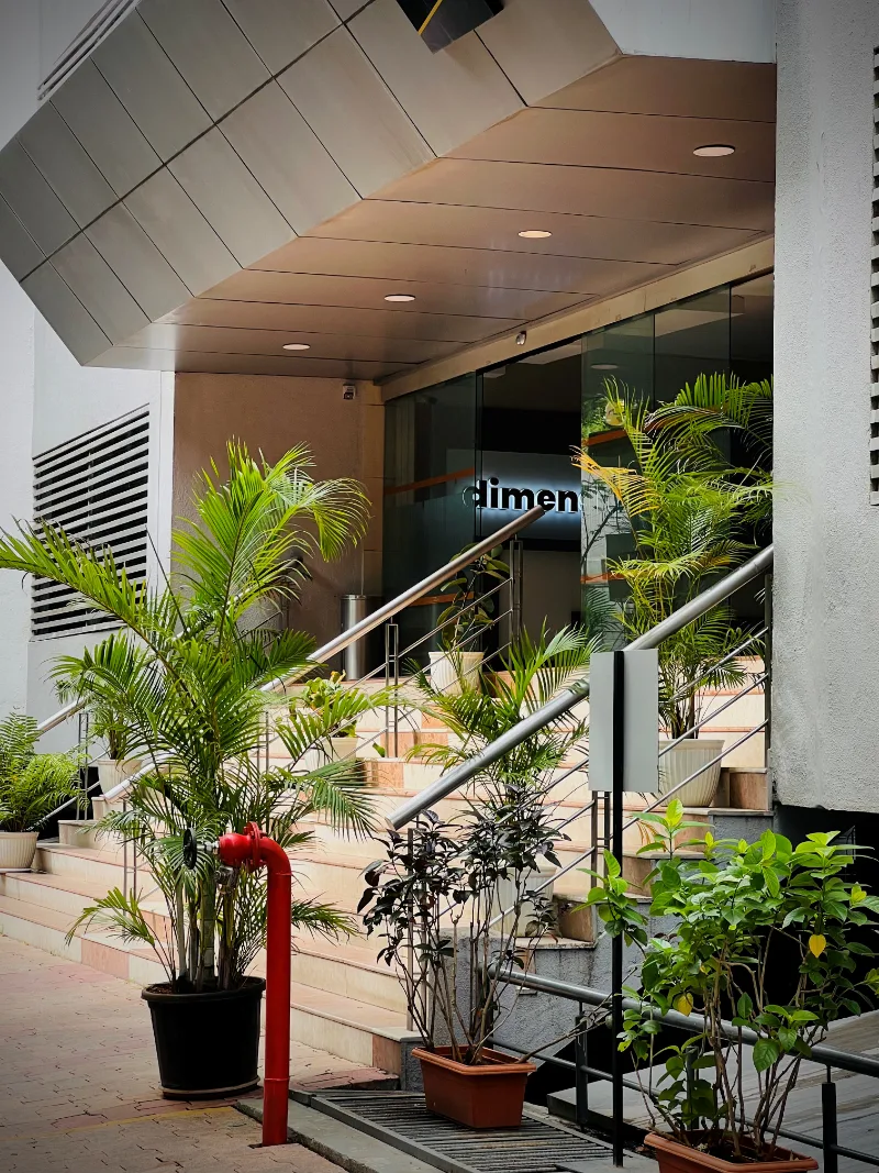 The entrance to Prabhavee Tech Park in Baner, planted with palms either side of the steps.