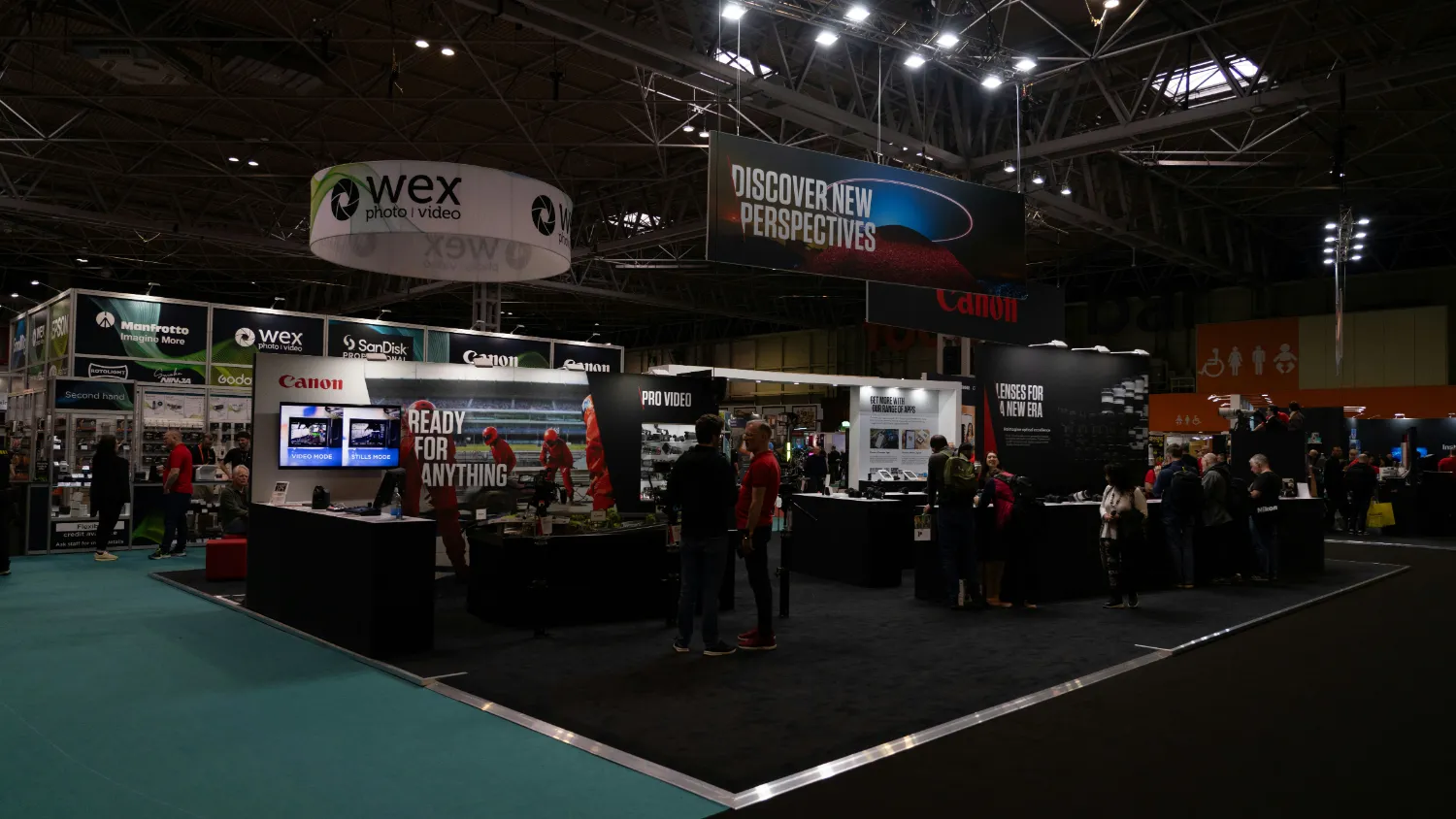 An exhibition stand under construction on a trade show floor.