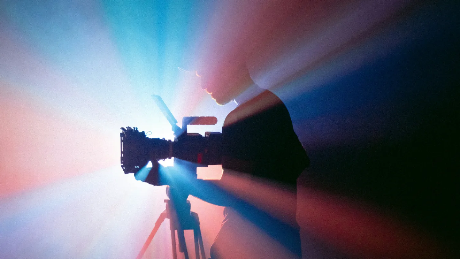 A camera set up on a tripod during a shoot.